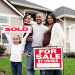 A happy family standing outside a home with a sign written, 'for Sale by Owner'. Their young child is holding up a sign written, 'SOLD'.