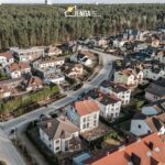 rows of homes along a curving road.